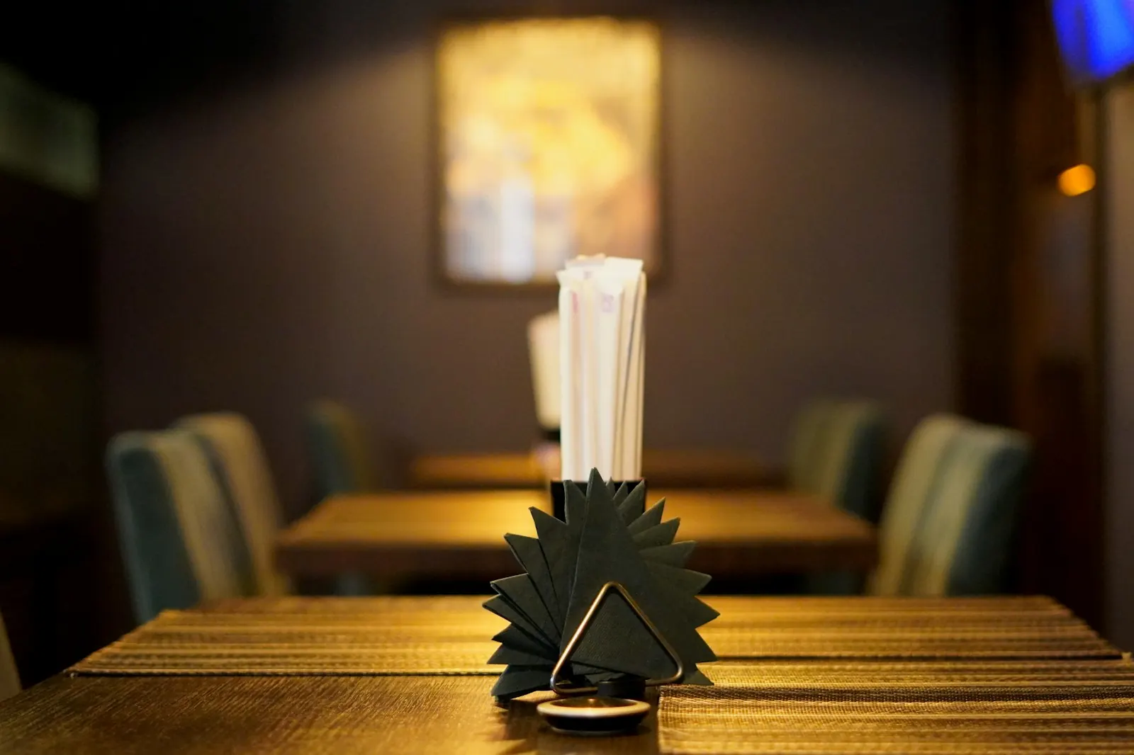 Single table set in a quiet, empty restaurant